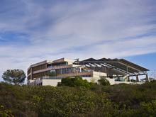Designed to achieve LEED-Platinum certification and a net-zero energy footprint, the building is the first net-zero energy biological laboratory in the country. - Photo Credit: © Nick Merrick