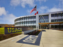 The formal east face and main entry of Federal Center South Building 1202 is fitting of a federal building entry. The strong axial front emphasizes the Army Corps of Engineers’ mission of “Building Strong.” - Photo Credit: Benjamin Benschneider