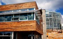The reclaimed wood that comprises the CSL building skin was salvaged from dilapidated regional barns. - Photo Credit: Denmarsh Photography, Inc.