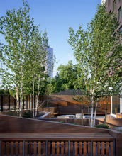 The building features two courtyards that are both constructed with durable materials such as painted concrete and weathering steel, a recycled and recyclable product. Many materials used in the building’s construction are either locally sourced or sustainably harvested and produced, including local brick, local concrete, and local, FSC-certified interior siding and trim. - Photo Credit: Sally Schoolmaster