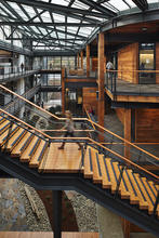 Daylight enters the buildings from all sides, as well as the overhead skylight. A varying degree of frit across the glass roof responds to solar exposure. Conference rooms and meeting facilities in the building’s core enable energy-efficient HVAC zoning and operating cost savings. - Photo Credit: ZGF Architects LLP