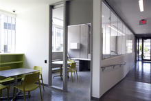 Homeless resource center's hallway and meeting room demonstrating adaptive reuse potential. - Photo Credit: Sally Schoolmaster