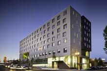 Bud Clark Commons; Dusk view from SW. - Photo Credit: Christian Columbres Photography