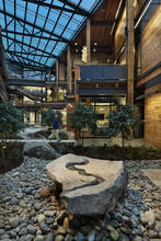 Green River “source stone” is an expression of the USACE’s focus as an agency. The boulder flows with harvested rainwater as it’s collected on the roof. - Photo Credit: Benjamin Benschneider