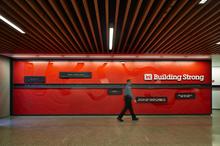 Interior entry of Federal Center South Building 1202 with supergraphic of the U.S. Army Corps’ of Engineers mission, “Building Strong.” - Photo Credit: Benjamin Benschneider