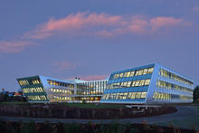 Federal Center South Building 1202 west facade pictured at night. - Photo Credit: Benjamin Benschneider