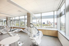 Recognizing the importance of natural light and its link to productivity and health, the design team strove to daylight all regularly occupied spaces, while mitigating heat gain, by providing filtered light through shades attached to window mullions located above the view area. - Photo Credit: Alene Davis Photography