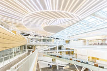 The project chose to use low maintenance, durable materials throughout the building. An LED light art installation by Pae White in the atrium takes advantage of the low energy use of this lighting form to provide a large scale dramatic architectural element that mimics the color spectrum of daylight. - Photo Credit: Alene Davis Photography